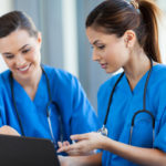 beautiful female healthcare workers using laptop